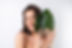 closeup-beauty-portrait-topless-woman-with-perfect-skin-natural-makeup-with-monstera-palm-