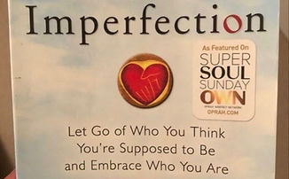 A copy of 'The Gifts of Imperfection' by Brene Brown