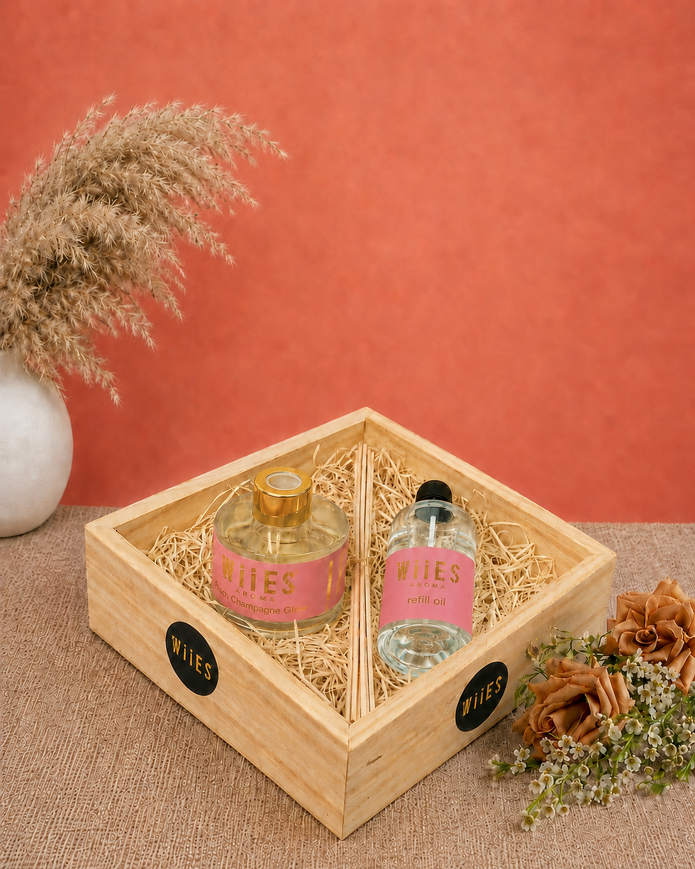 Premium reed fragrance gift hamper with Blush Champagne Glow reed bottle refill oil and reed sticks