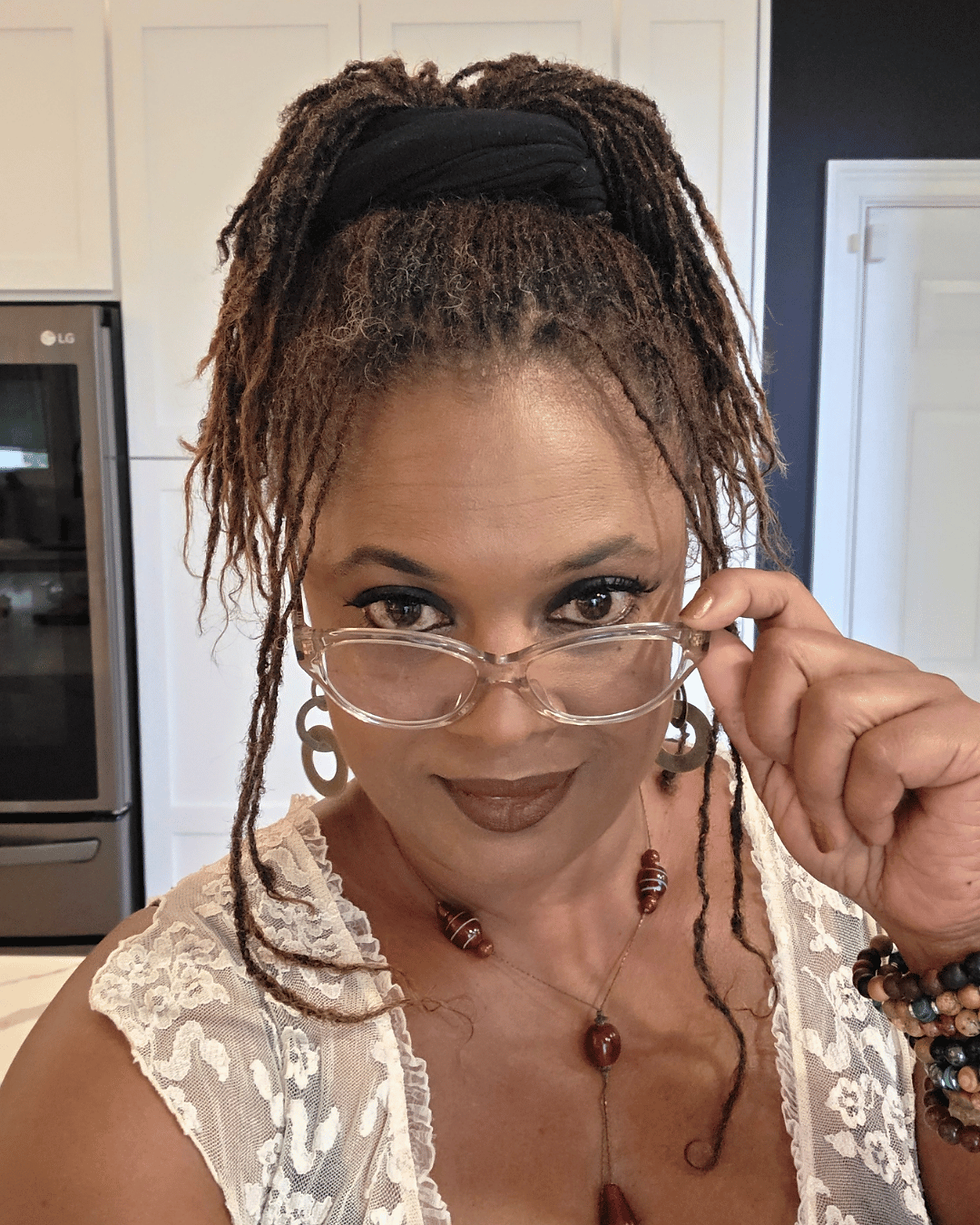 renee ventrice in kitchen looking over glasses