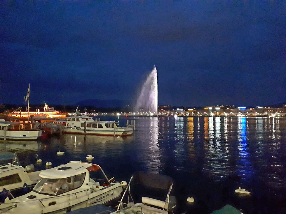 Geneva: nighttime shot with the Jet lit up, with reflections on the lake