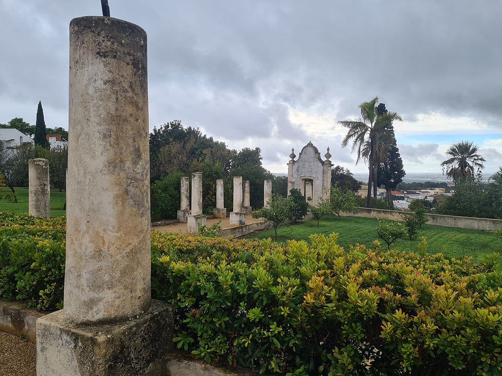 Gardens and stone columns at Estoi Palace near Faro in the Algarve, Portugal
