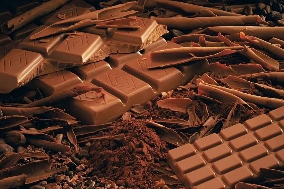 Close-up of classic Swiss chocolate bars stacked on a wooden surface, with rich textures and a deep cocoa color.