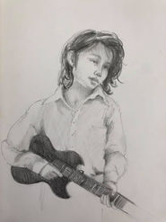 A girl playing guitar.