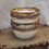 Thumbnail: Speckled Ivory Bowls with Bronze Edge