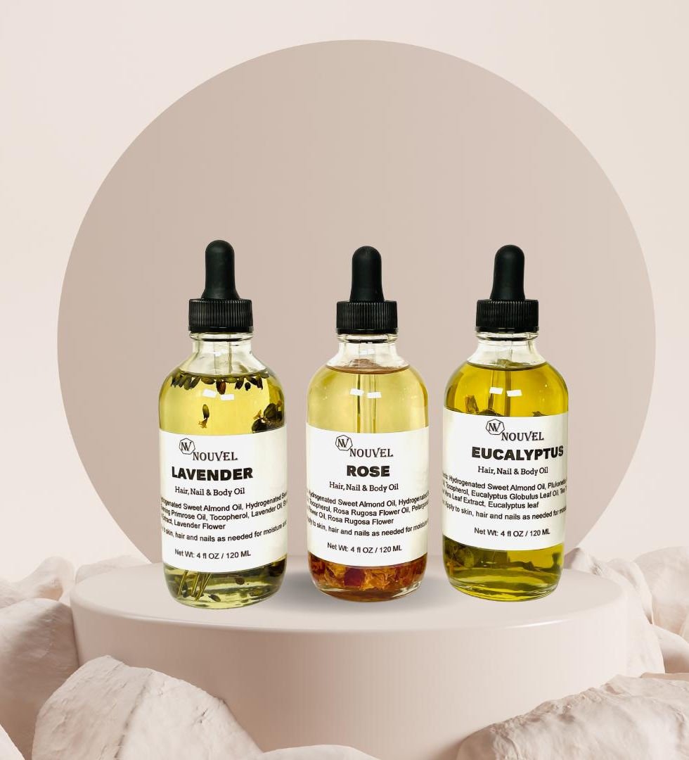 A collection of Nouvellâs luxurious multi-use oils including Rose, Lavender, Eucalyptus, elegantly di