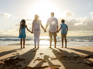 Family at sunset on a Hawaii beach