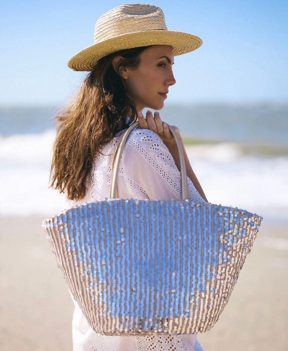 Model with Pia Rossini sequin beach bag in silver