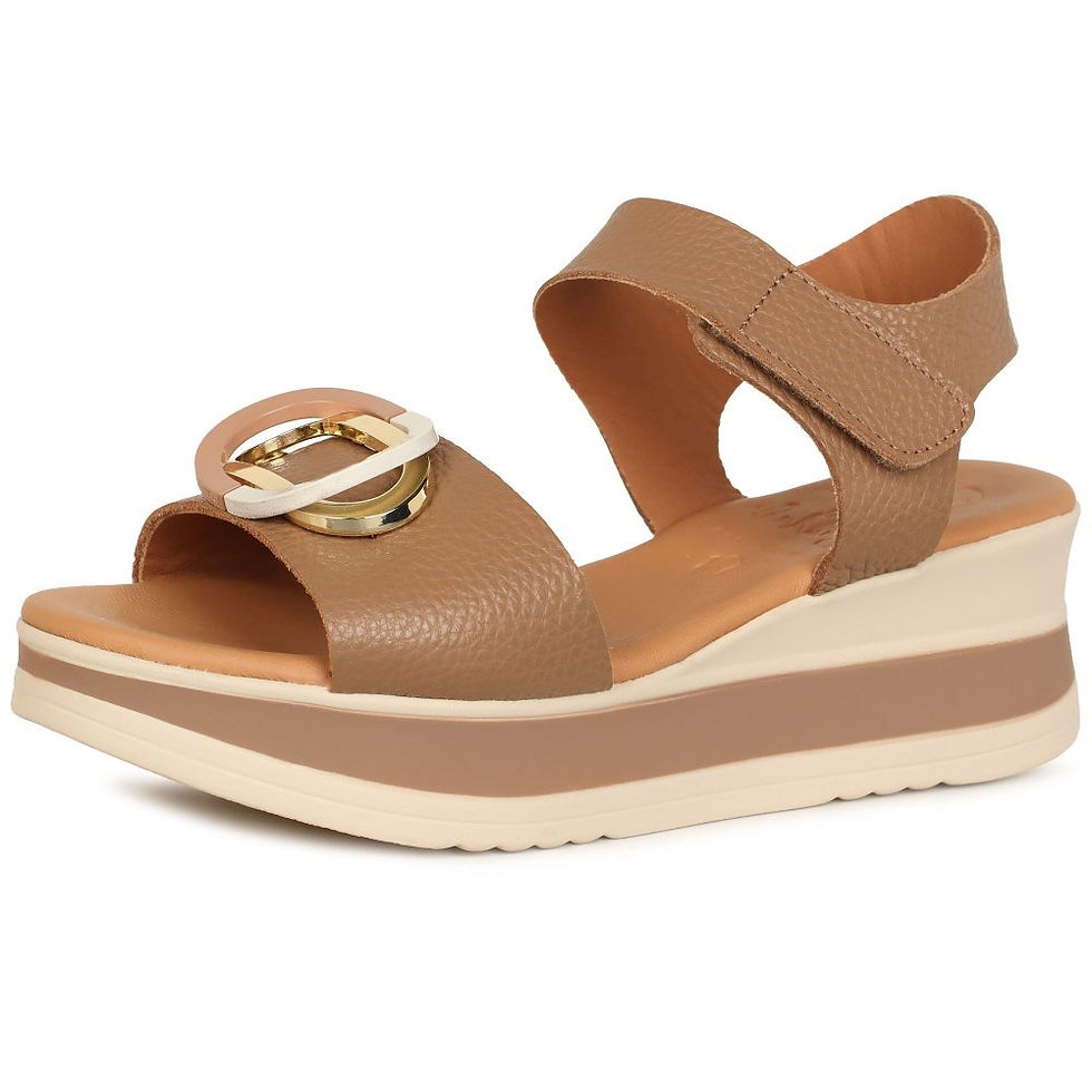 Three-quarter angle view of taupe leather wedge sandal styled for summer wear