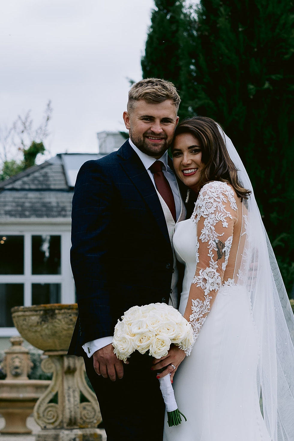 bride with veil and groom