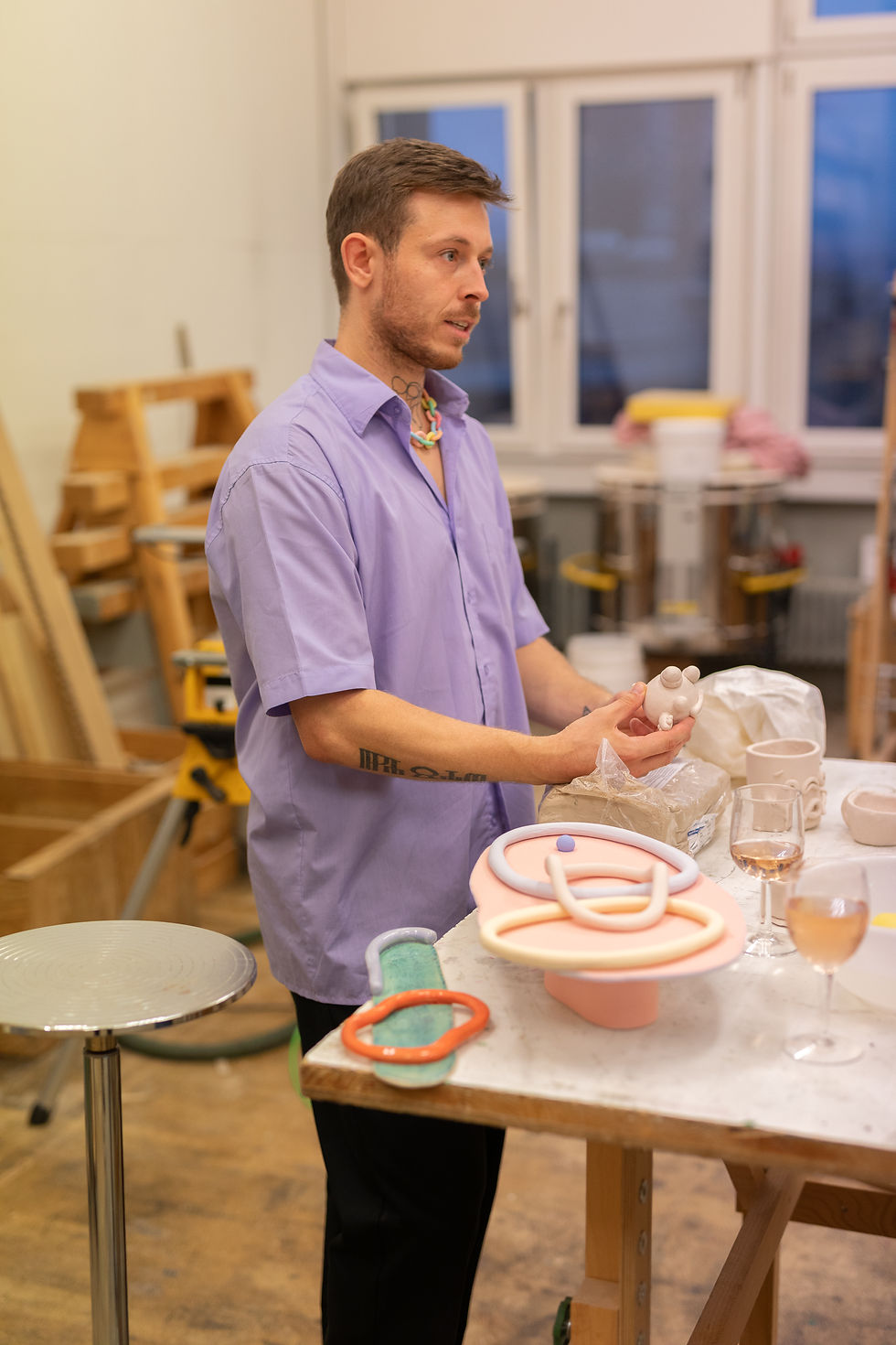 Owner of the brand QUIRKEEZ while leading a pottery workshop in his pottery studio