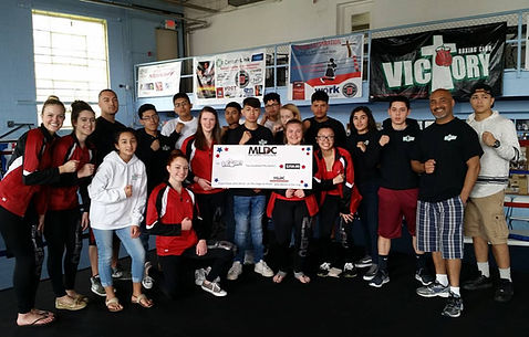 Mary Lorraine's Dance Center presenting their donation to Omaha Victory Boxing Club