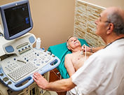 Senior man having medical exam. Elderly patient is having ultrasound examination of his he