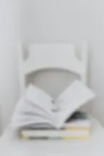 Textbook open with glasses in the middle