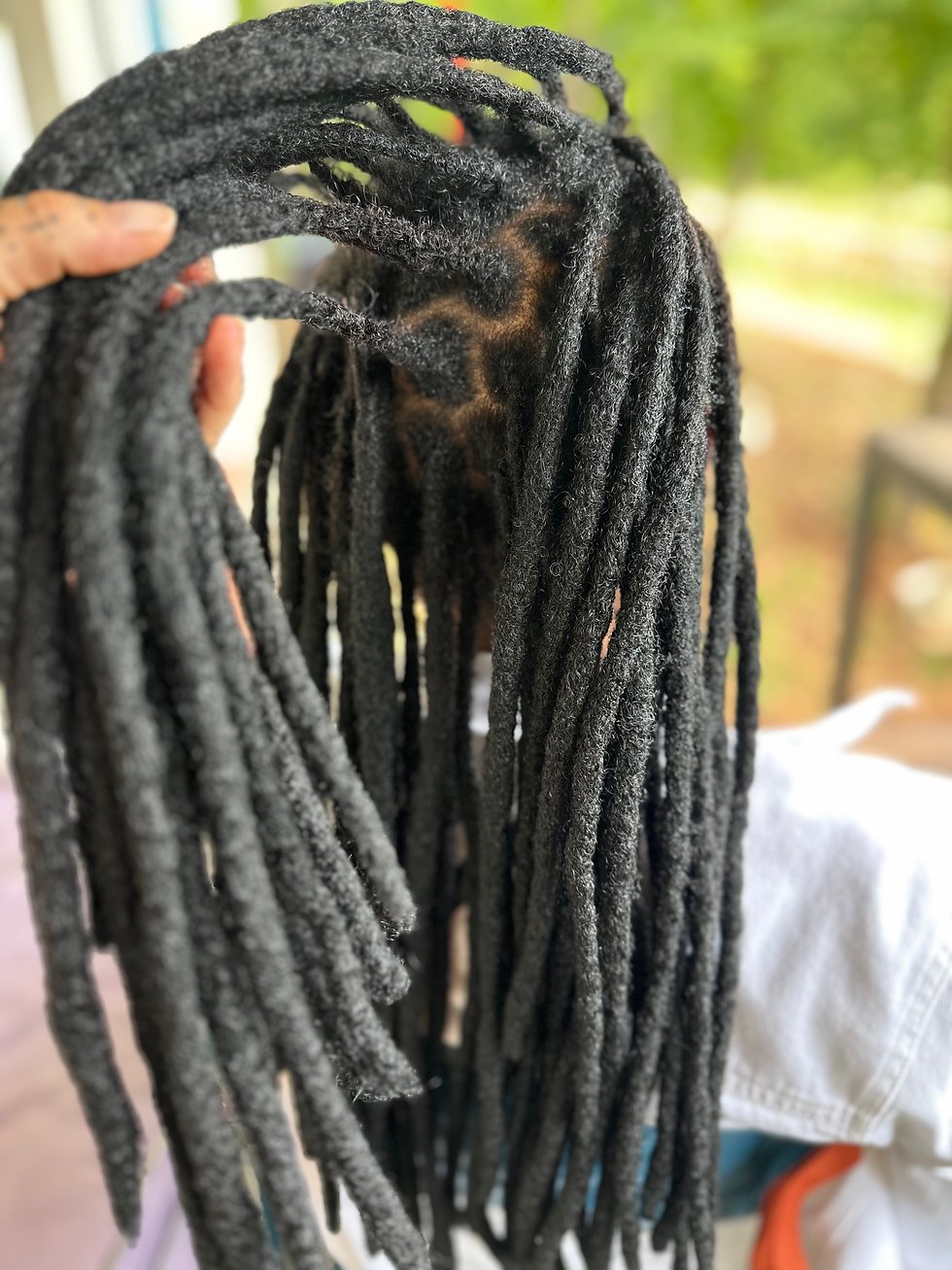 Close-up view of well-maintained dreadlocks with a natural shine