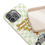 Thumbnail: Wavy green check patterned biodegradable phone case with "Hocus Pocus There's Pizza On Your Focus" text
