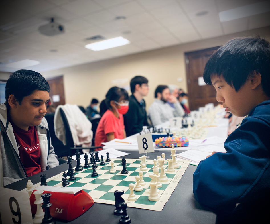 Rishi Rathi with the black pieces against Kelvin Xie at the 1st Norman Fall Class Championships, a chess tournament held Nov. 12 & 13 in Norman, Oklahoma. Photo by Rebecca Rutledge.