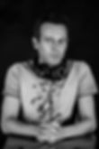 A close-up in black and white by Luca Torchiani the Italian voiceover actor with a pair of headphones around his neck