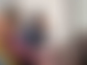 A man leaning forward in his seat.