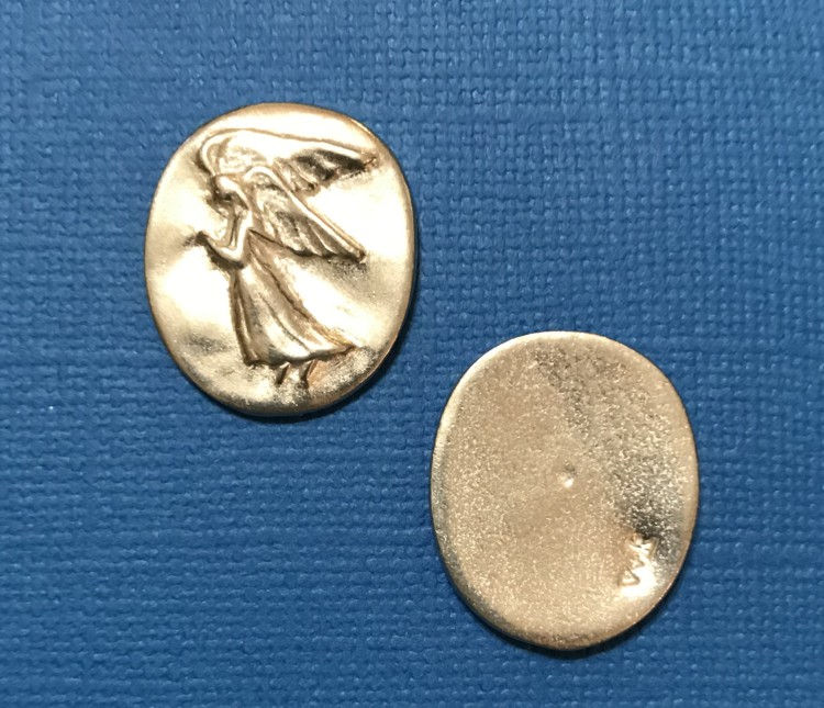 Thumbnail: The front and back of a silver oval stone with an angel on the front side.