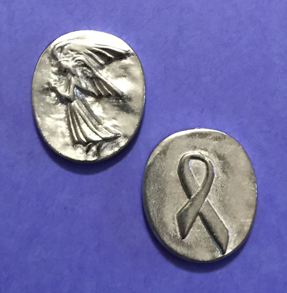 Two metallic tokens rest on a purple background; one features an angel, while the other displays a ribbon symbol.