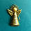 Thumbnail: Gold megaphone angel pin on a green background.
