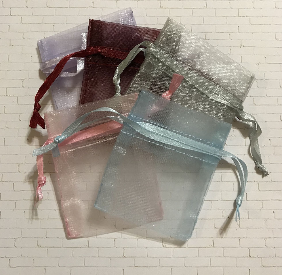 A burgandy, silver, light blue, pink and lavender organza bag on a white background.
