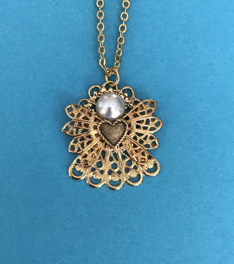 Thumbnail: A stunning angel necklace featuring a pearl head,  a heart in the wings, and sparkling birthstones.