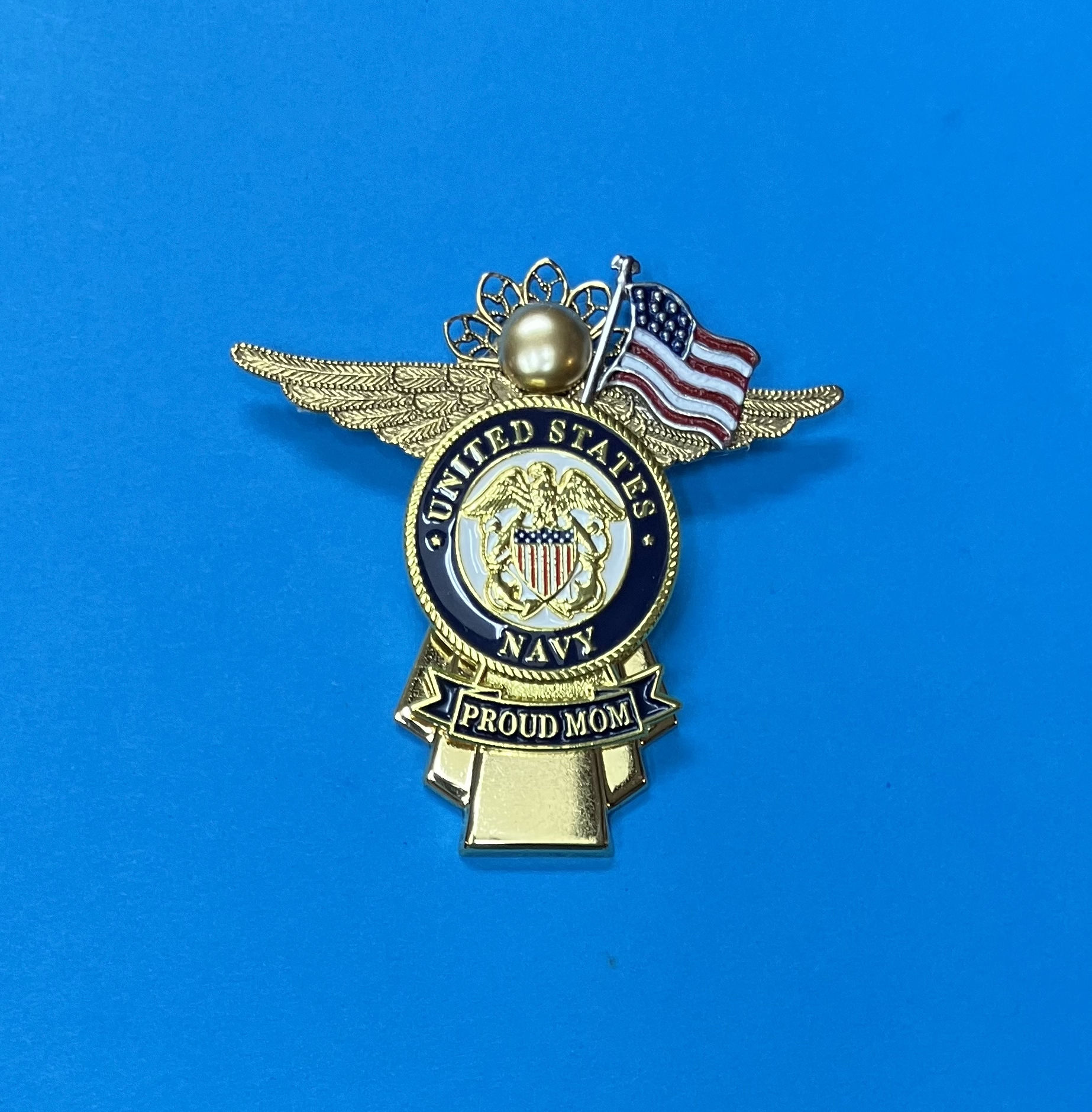 Gold badge with "United States Navy," showcasing a proud mom angel pin and an American flag in military-style wings.