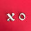Thumbnail: Silver metal "x" and "o" letters on a red background.