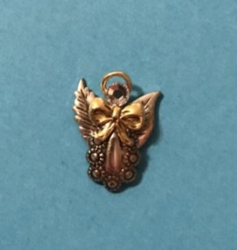 Thumbnail: An elegant angel pin in silver, adorned with a delicate bow, showcasing a refined accessory design.