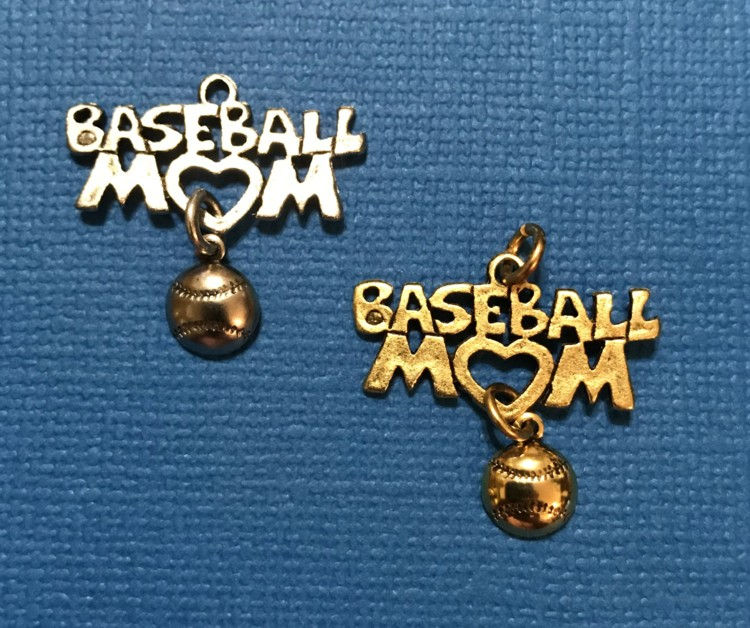 Thumbnail: Two baseball mom charms with a baseball hanging from the charm, one silver, one gold.
