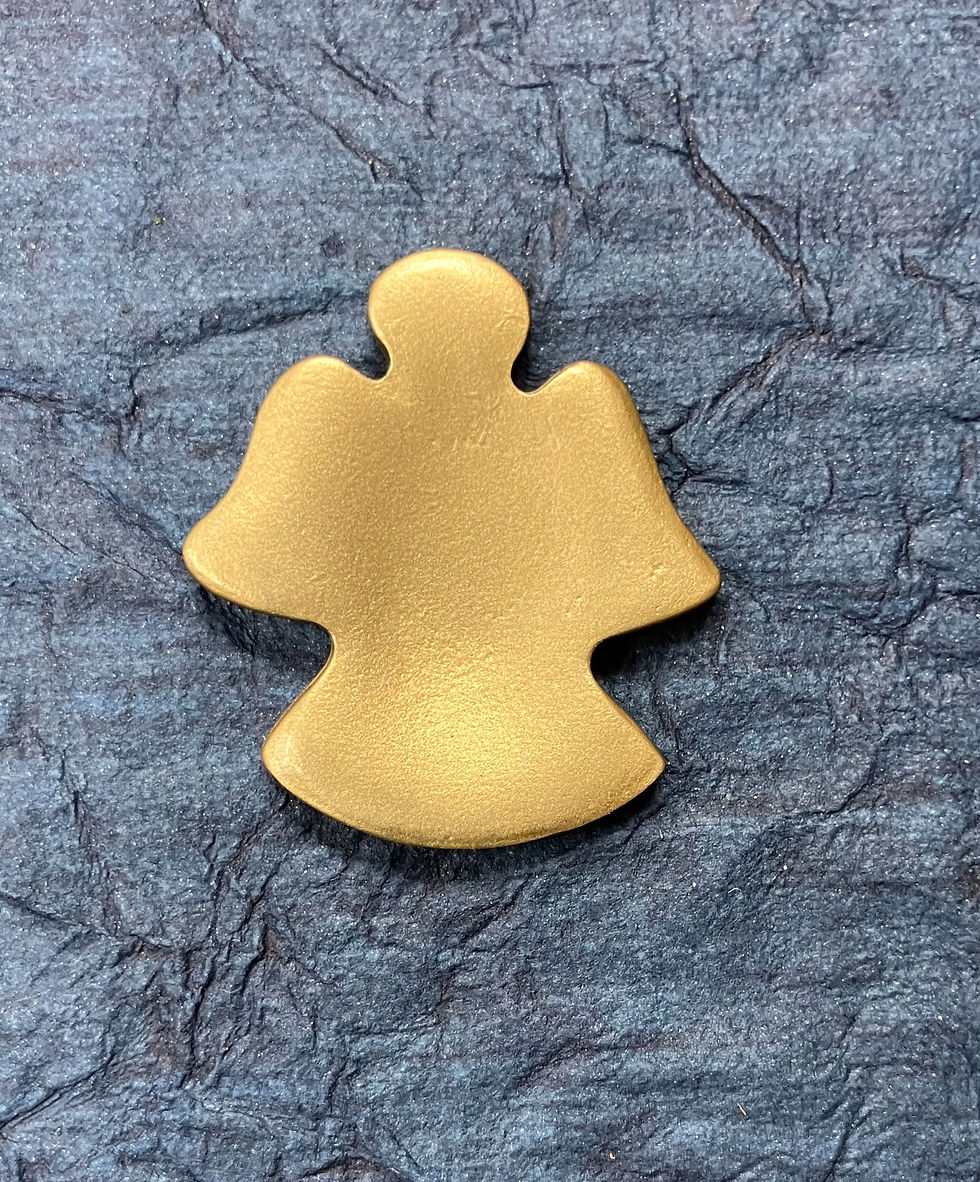 Thumbnail: the back of a gold angel shaped stone