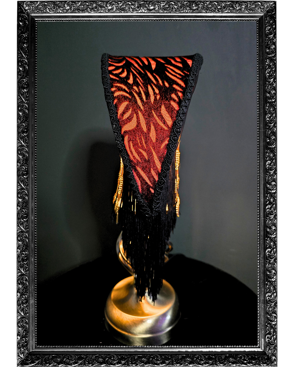 Thumbnail: side view of moon crescent shaped lampshade in black and orange with black fringing 
