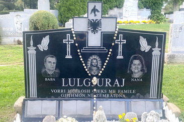 Jet Black Memorial with a custom shaped Cross and 3 etchings. This memorial is installed at Gate of Heaven Cemetery in Hawthorne, NY.