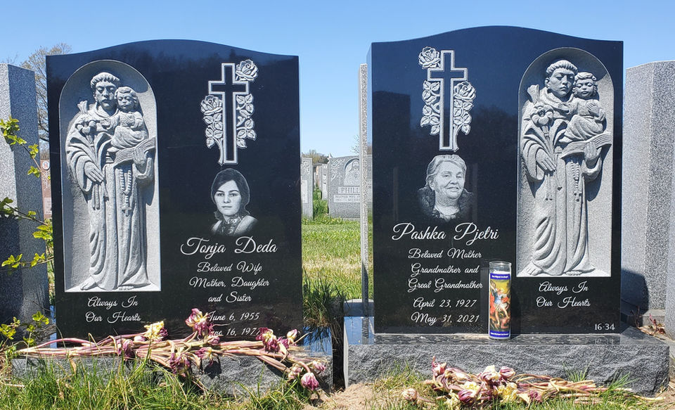 Mirror hand carvings at Saint Raymond's Cemetery in the Bronx, NY - Jet Black Granite