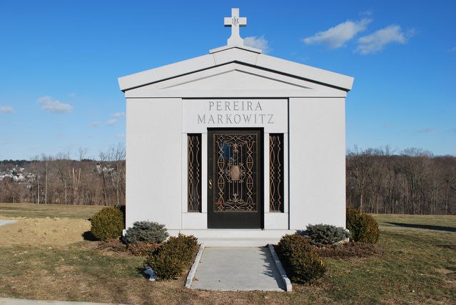 This beautifully and classically styled private family mausoleum features a clean and simple design with bronze doors. It was erected in Westchester County, NY.