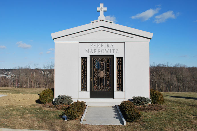 This beautifully and classically styled private family mausoleum features a clean and simple design with bronze doors. It was erected in Westchester County, NY.