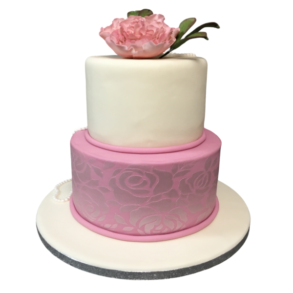 Two-tier wedding cake with white and pink sugar paste, floral accents, and peony.