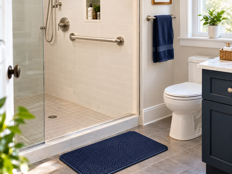 Bathroom with a newly installed grab bar and non-slip mat near the shower