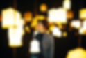 closeup-shot-happy-young-lady-room-with-many-bright-chandeliers.jpg