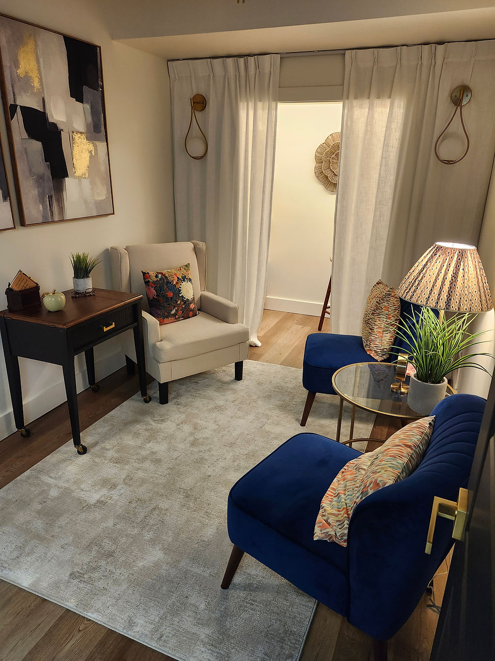 Cozy functional medicine consultation room with blue chairs.