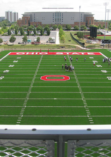 Full-field football practice view from 52-foot end zone tower