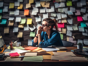 Sticky notes everywhere and person looks physically exhausted
