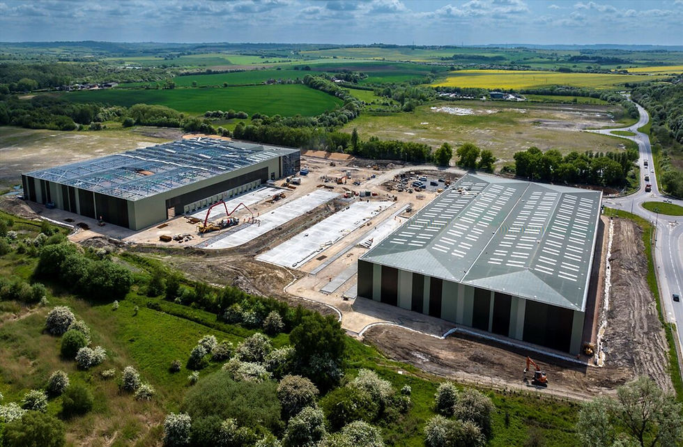 A drone shot of 2 large fully constructed warehouses side by side