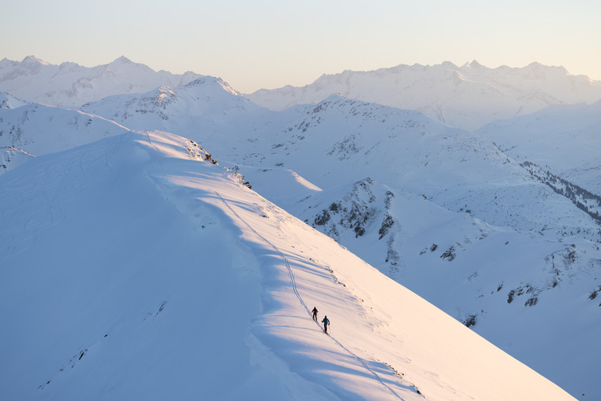 Ski tourers in a snowy winter landscape
