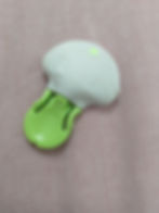 Photo of transmitter with sticky residue and green attachment