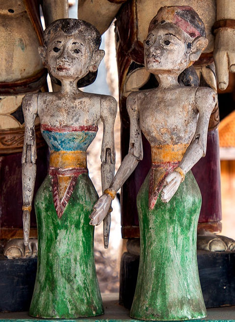 carved and painted teak statue representing a Javanese married couple, antique finish, Balinese craftsmanship
