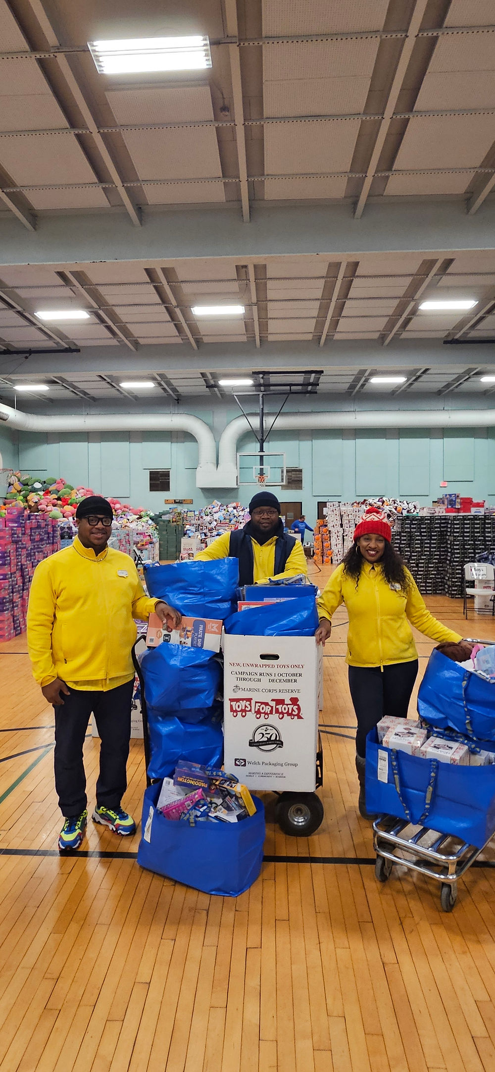 IKEA volunteers with bags of toys