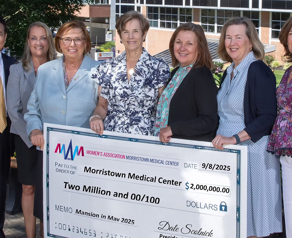 Women present a $2,000,000 check to Morristown Medical Center